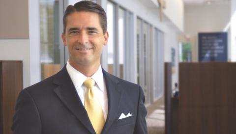 Man in suit smiling